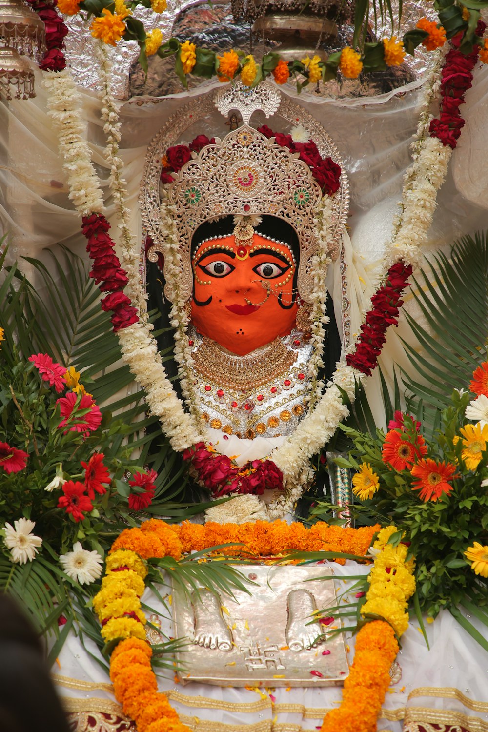 red and gold hindu deity figurine