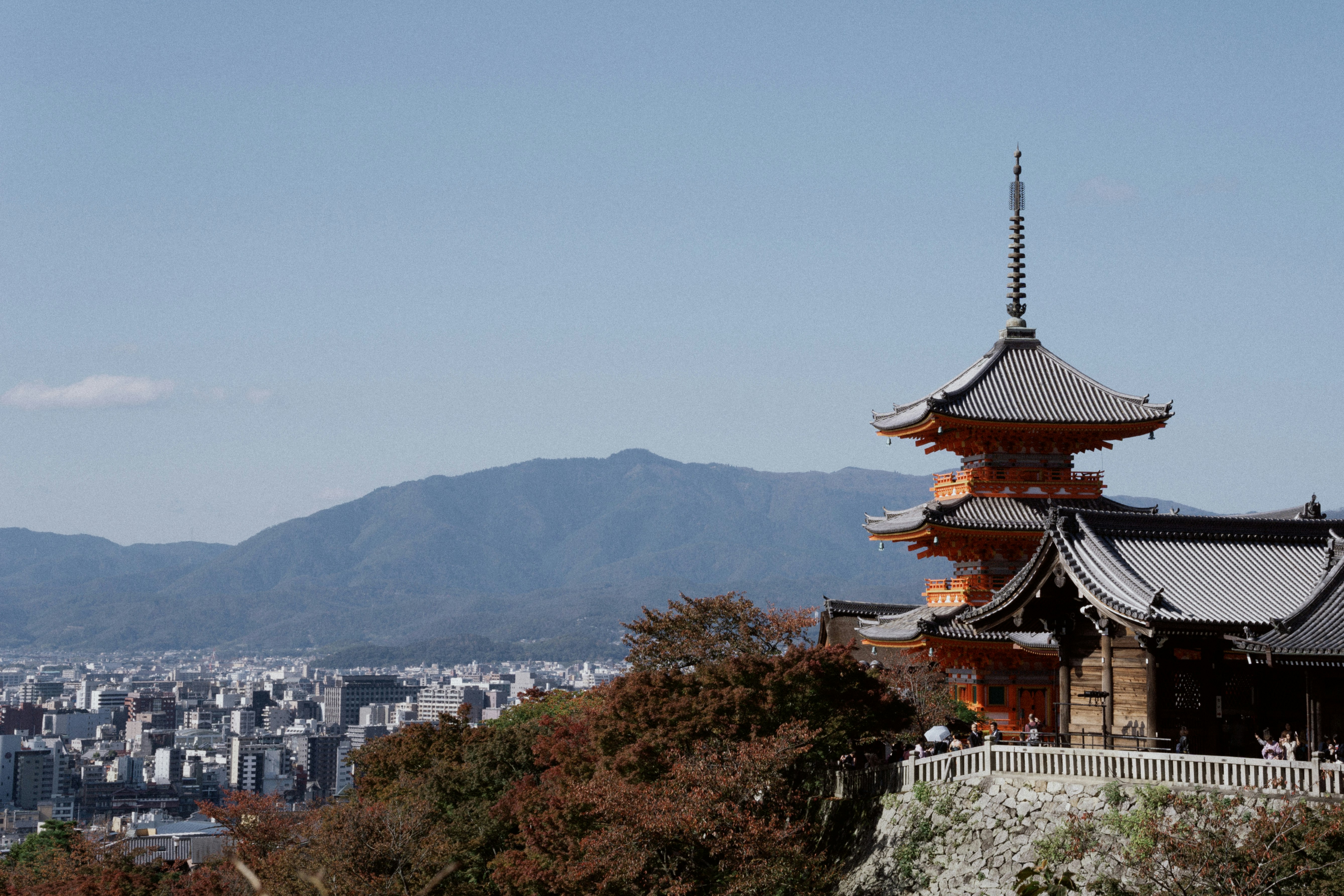 brown and white temple on top of mountain during daytime