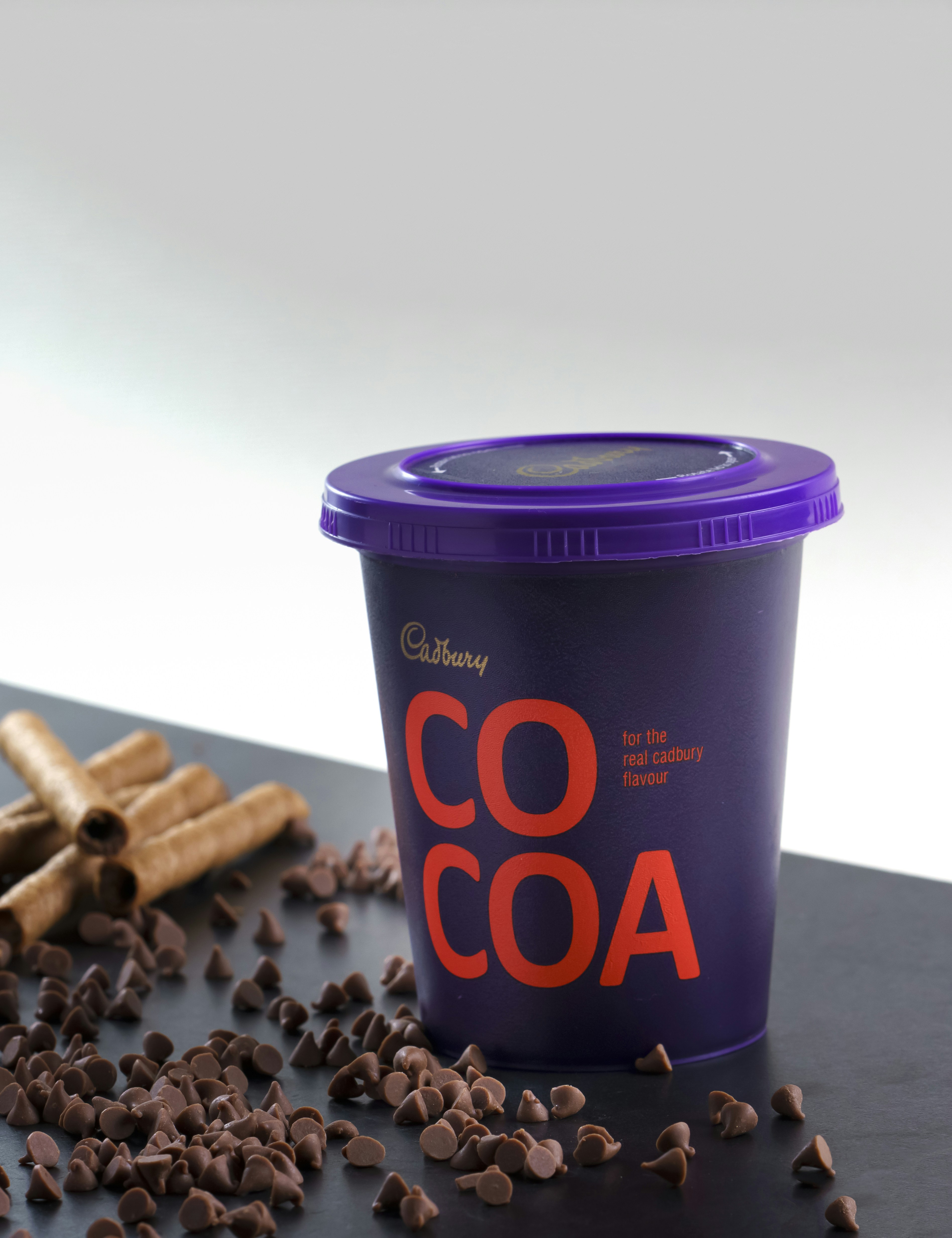 purple and black coffee cup