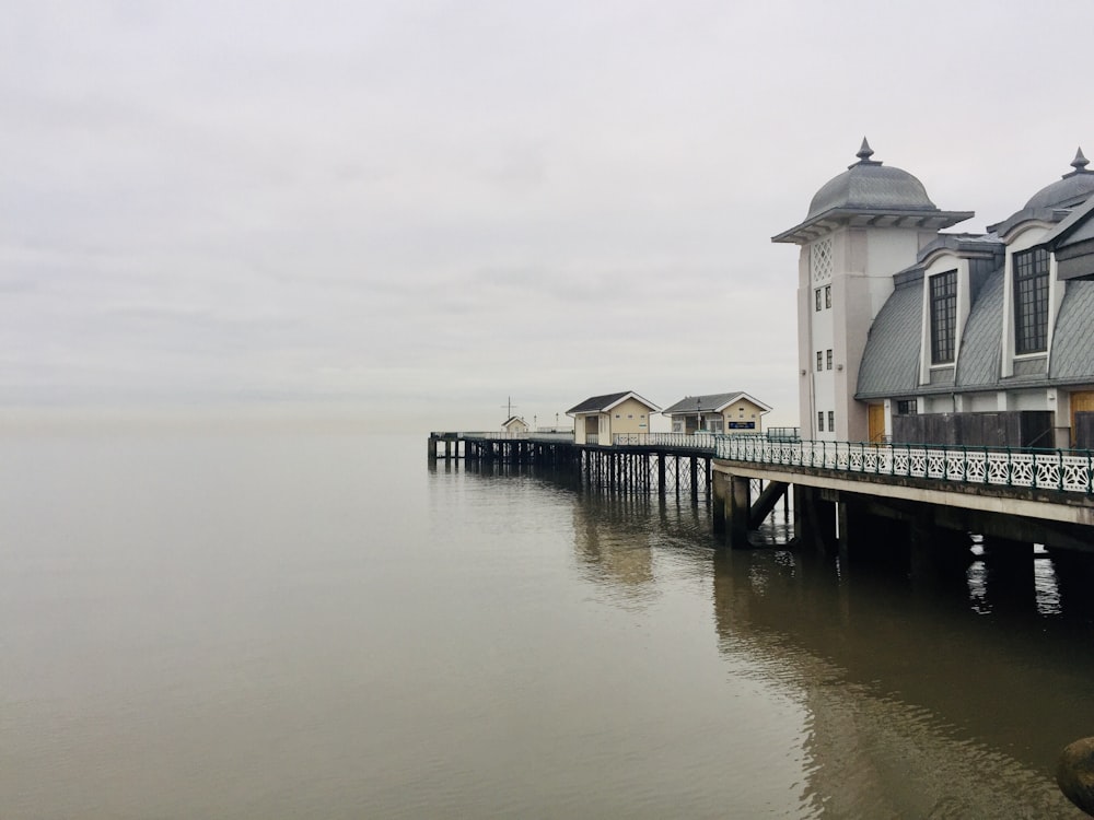 white wooden dock on body of water during daytime