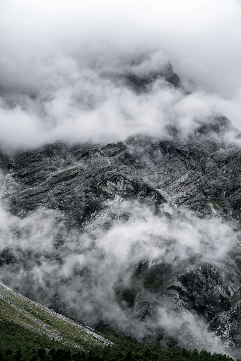 gray and white mountain under white clouds