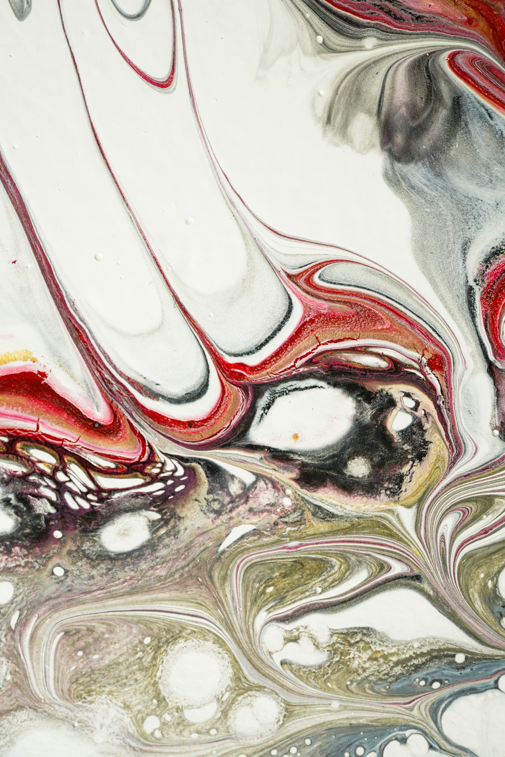 a close up of an abstract painting with red, white, and grey colors