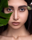 woman with green leaves on her head