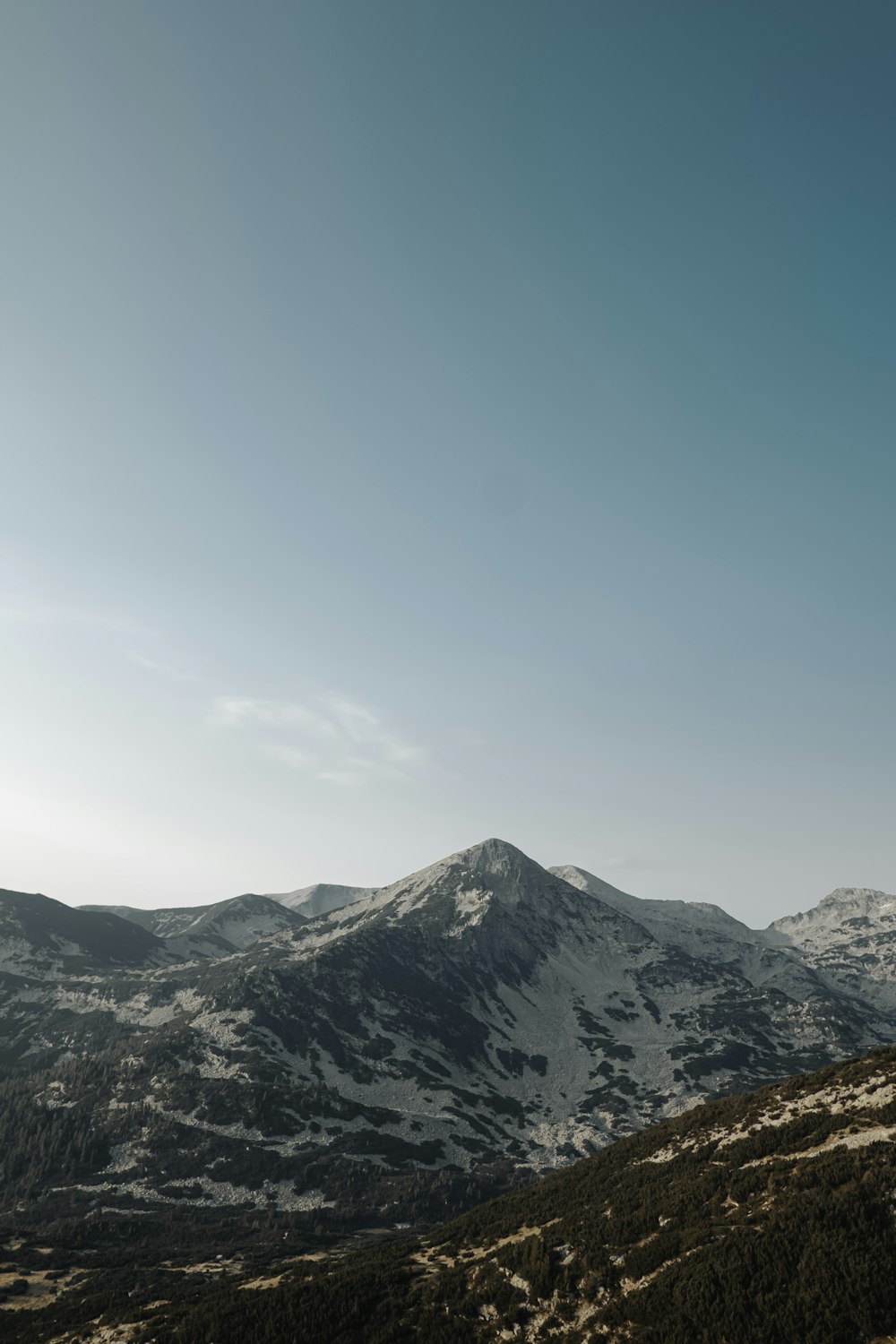 snow covered mountain under blue sky during daytime