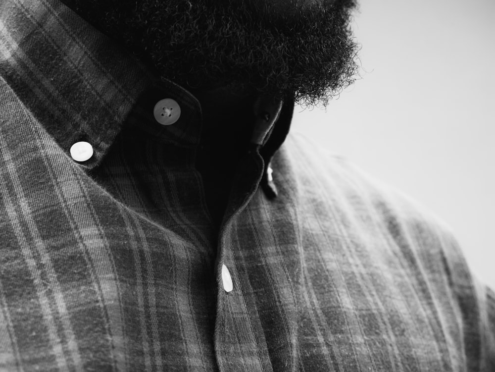 man in black and white plaid button up shirt