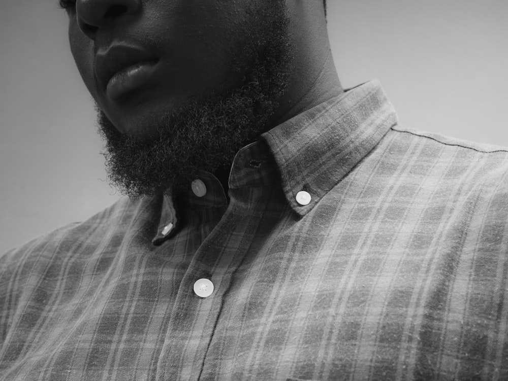 man in gray and white plaid button up shirt