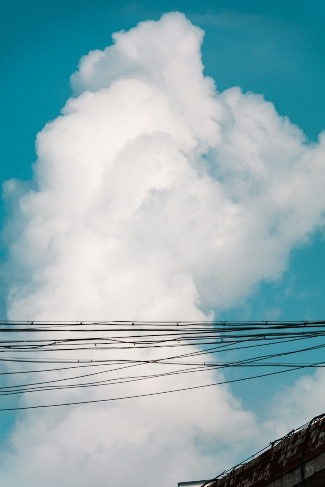 black electric wires under white clouds and blue sky during daytime