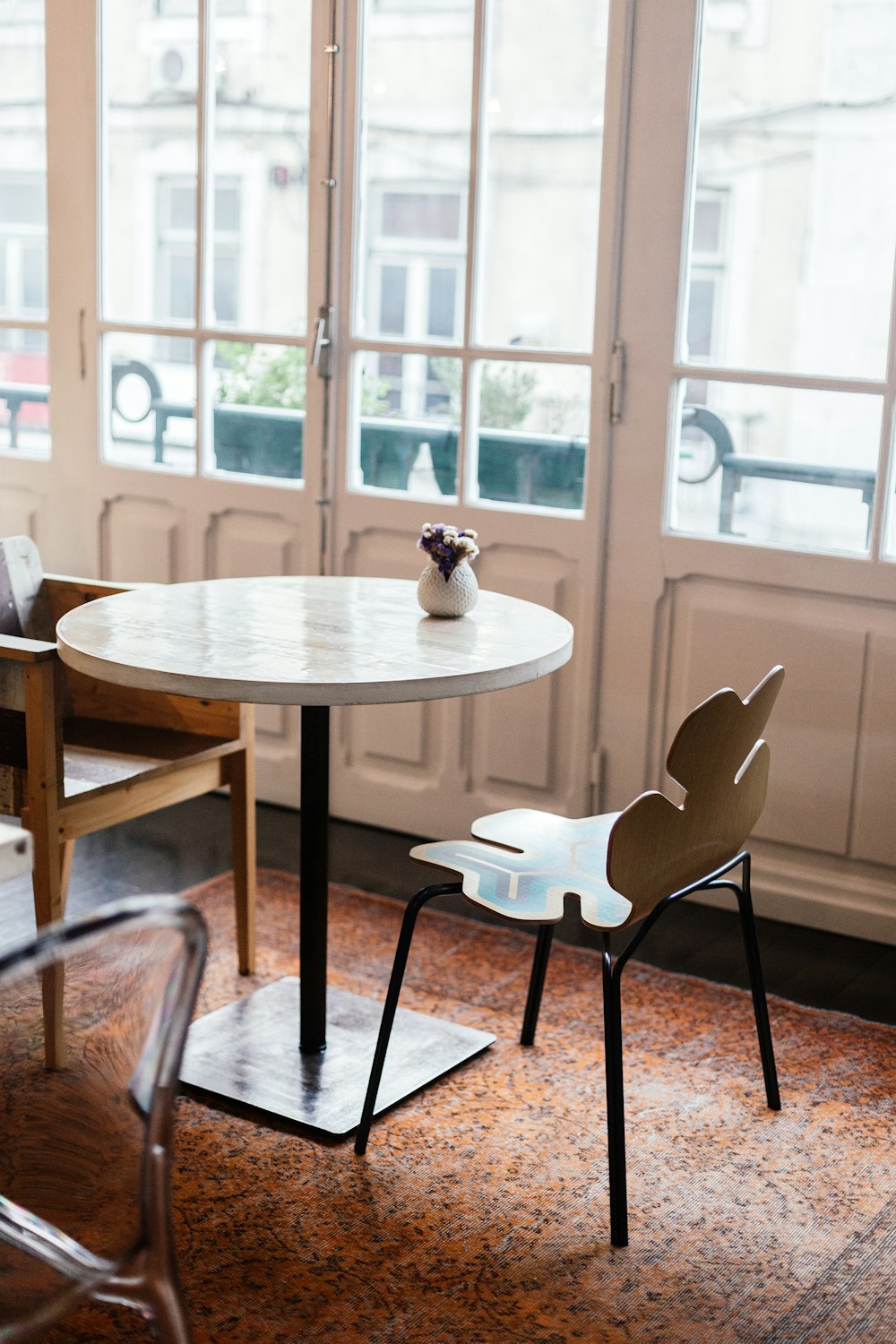 brown wooden table with chairs