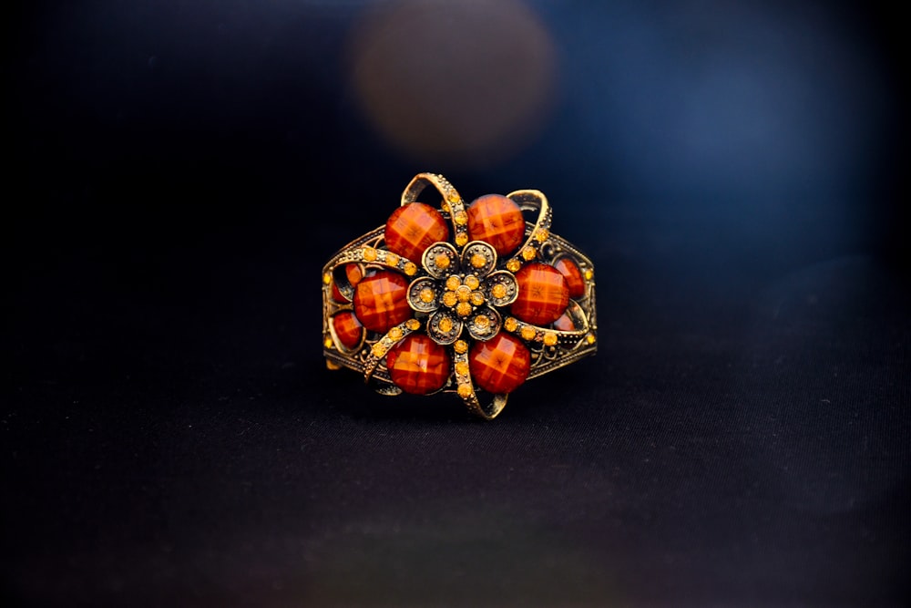 gold and red gemstone ring