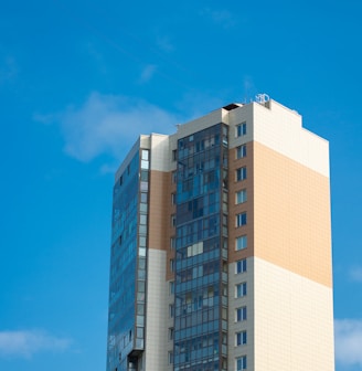 white and blue concrete building under blue sky during daytime