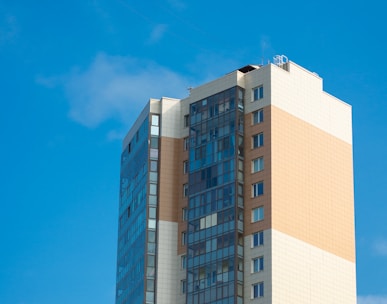 white and blue concrete building under blue sky during daytime