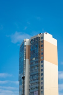 white and blue concrete building under blue sky during daytime