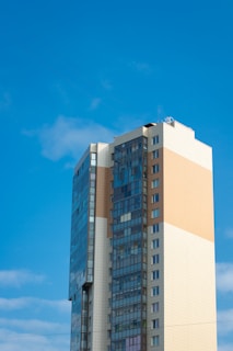Completed residential building standing tall under a clear blue sky in Fortaleza.