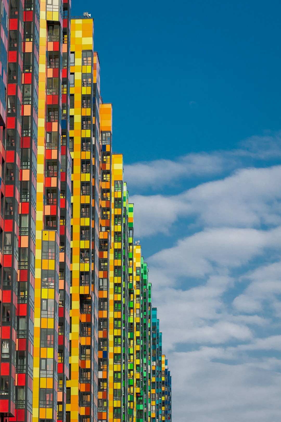 red yellow and green concrete building under blue sky during daytime