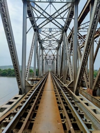 brown metal bridge over the river