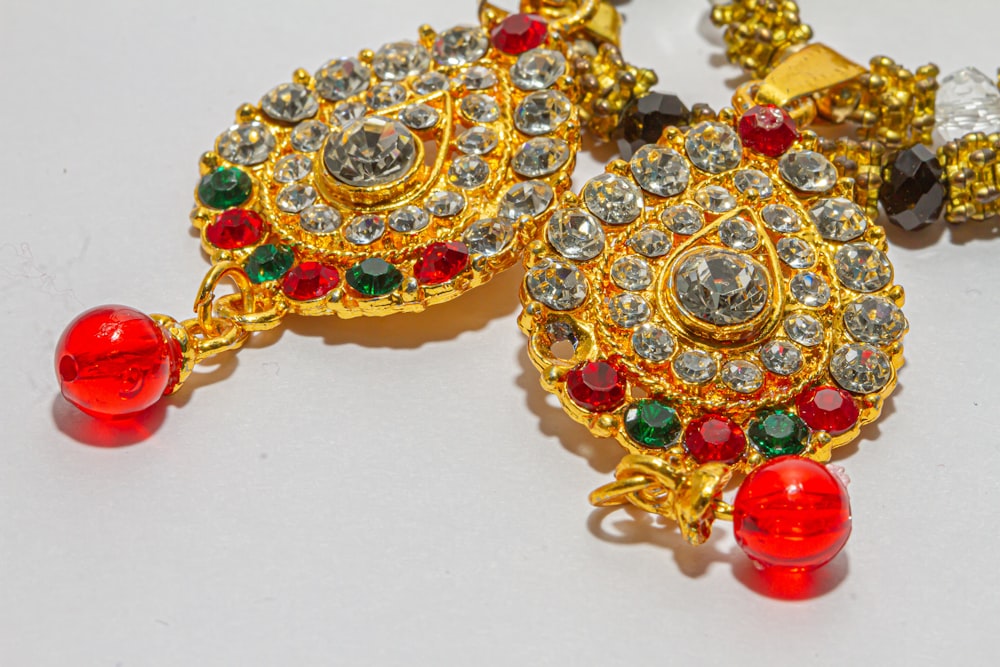 gold and red beaded accessory