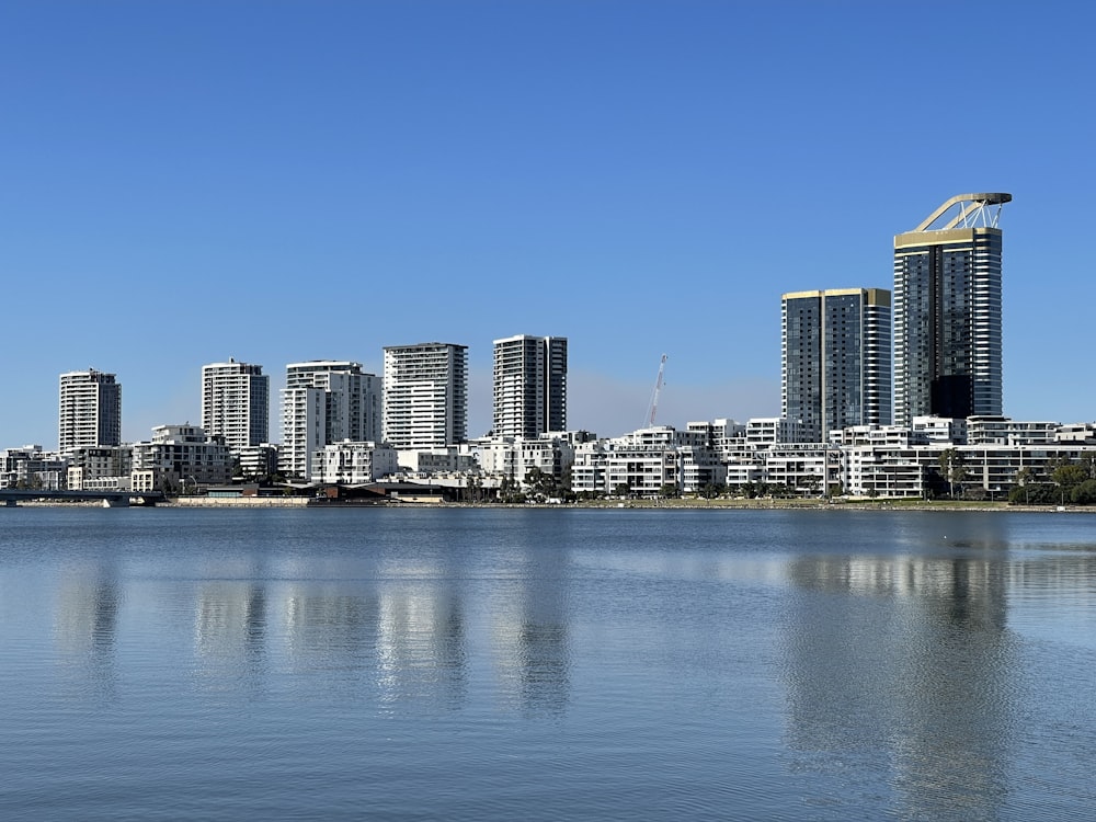 city skyline across body of water during daytime