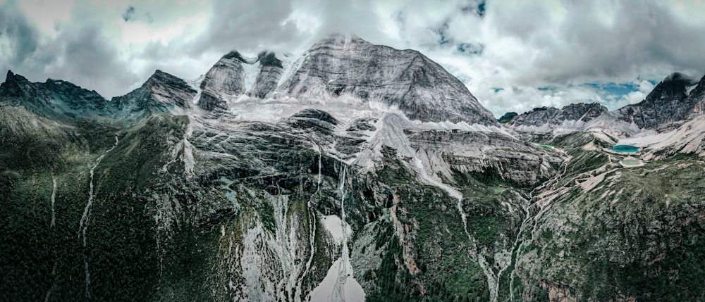 gray and white mountain under white clouds