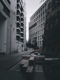 people walking on sidewalk near high rise buildings during daytime