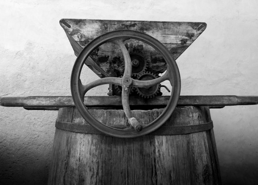 brown wooden wheel on wooden surface