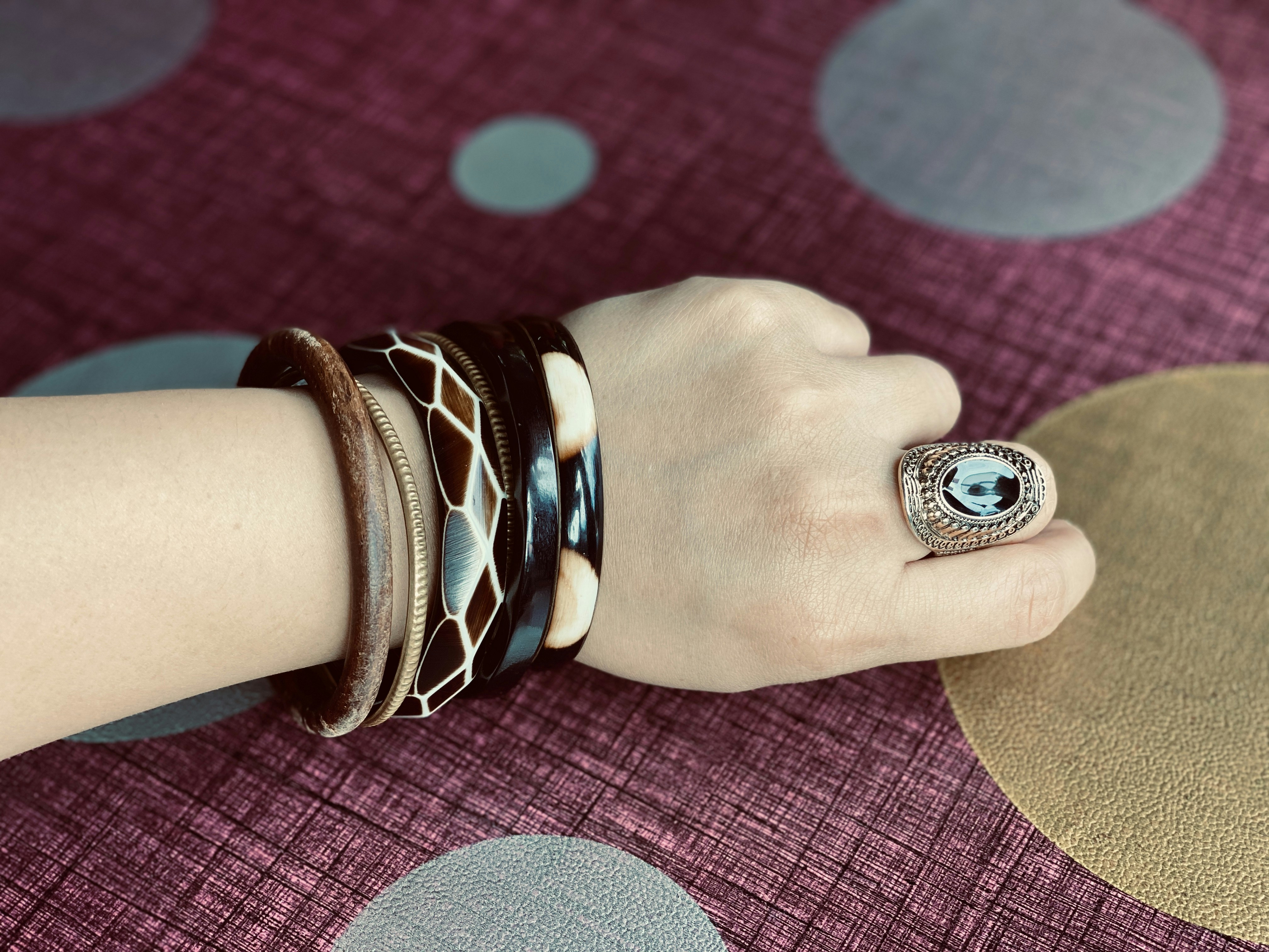 person wearing silver and black ring