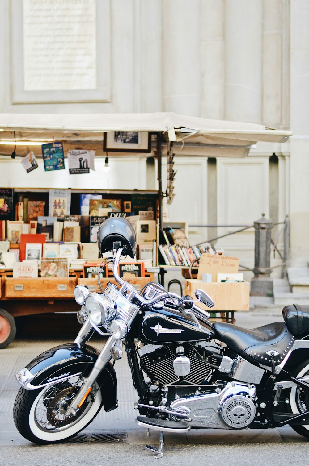 black and silver motorcycle parked beside brown cardboard boxes
