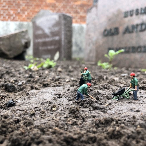 2 men in green and blue suit action figures