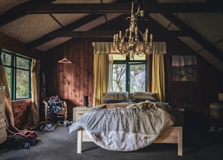 white bed linen on bed