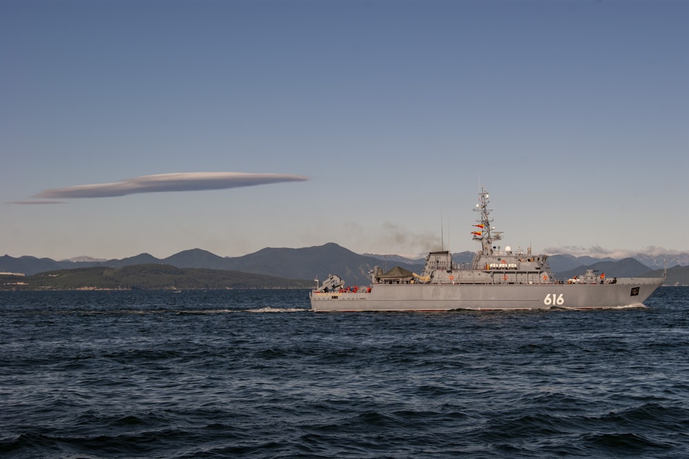 white ship on sea under blue sky during daytime