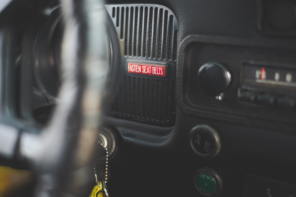 black car air vent with red and yellow light