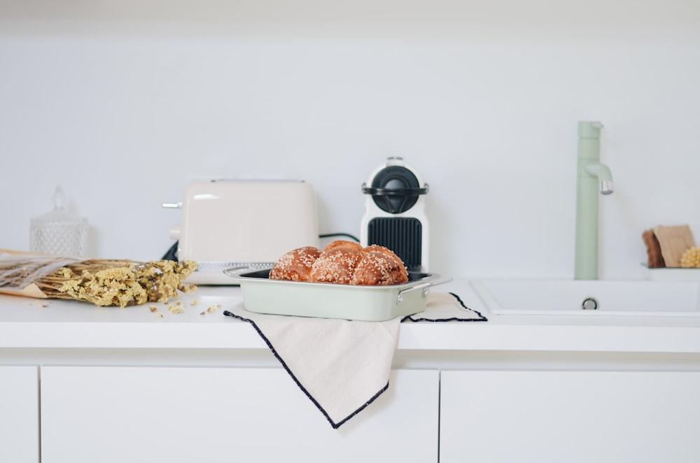 white plastic container on white table