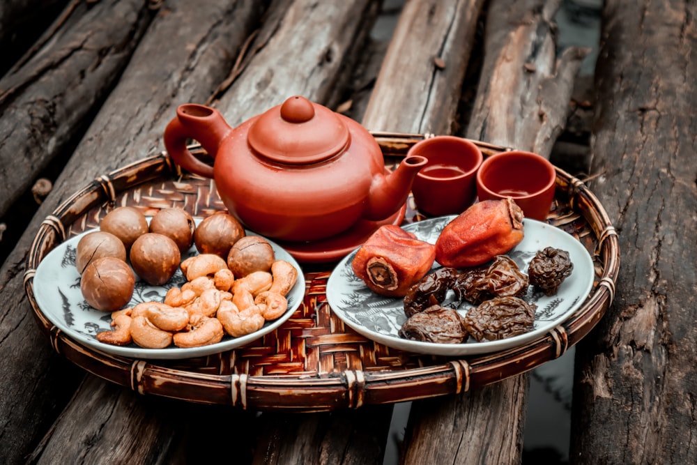 brown ceramic teapot on brown wooden table