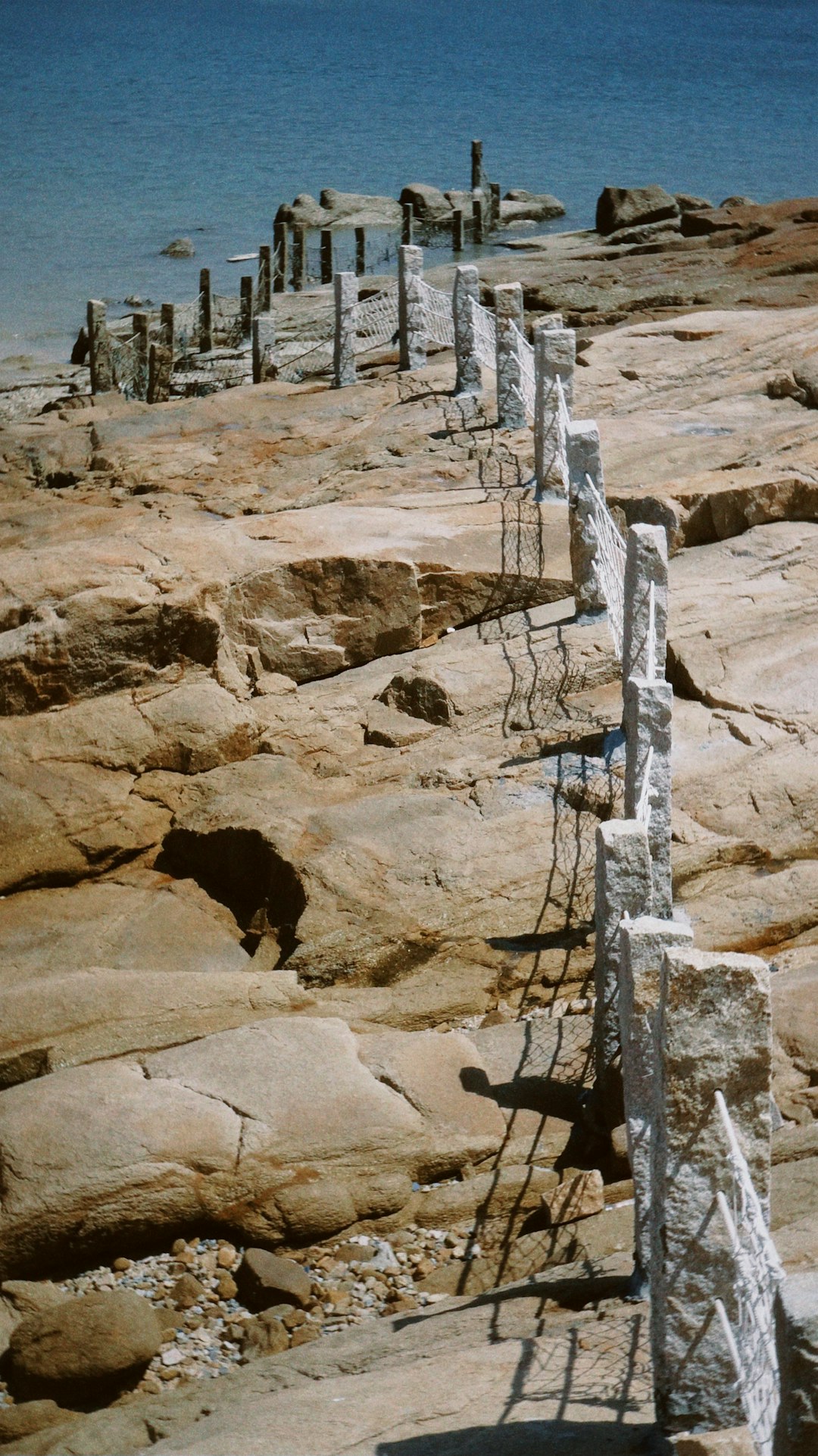 gray concrete stairs on brown rocky mountain during daytime