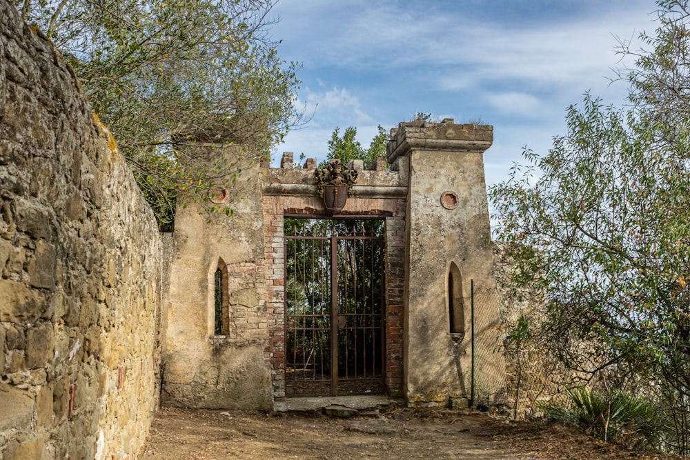 brown brick building with black metal gate