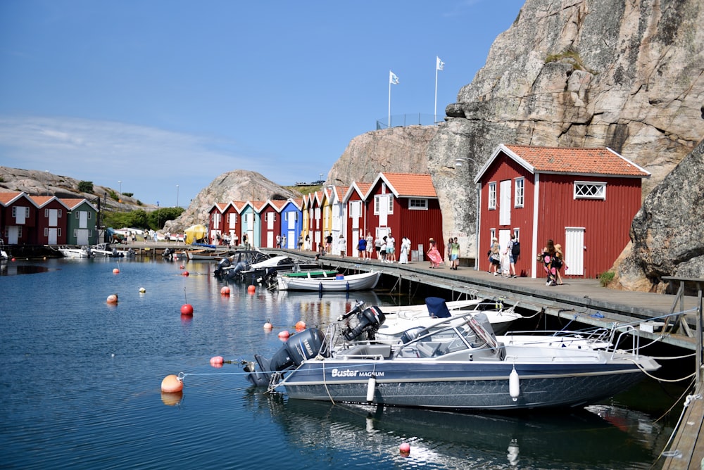 red and white house beside body of water during daytime