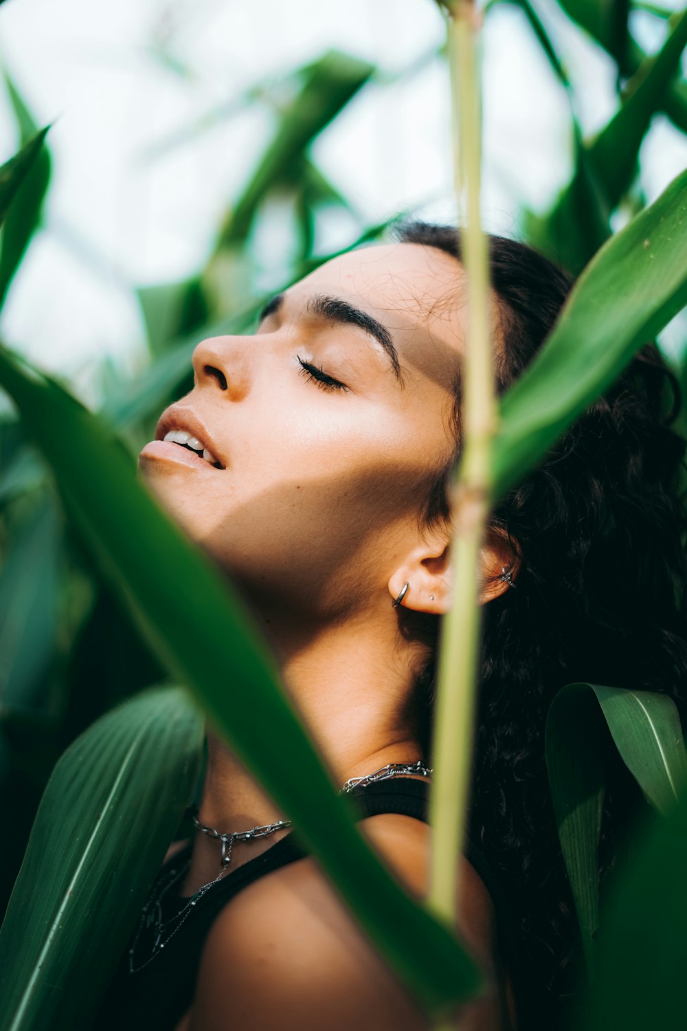 woman in black shirt with eyes closed