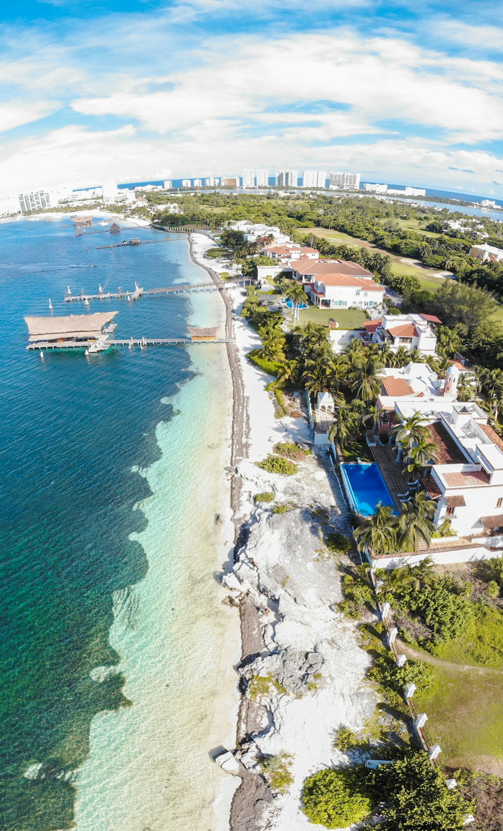 aerial view of city near body of water during daytime