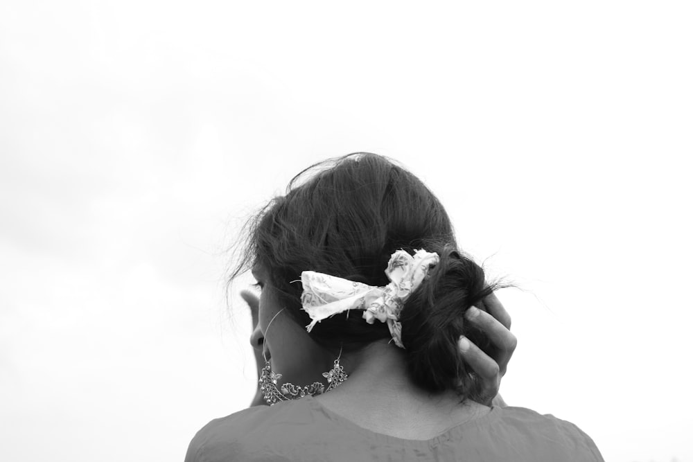 grayscale photo of woman in white floral dress