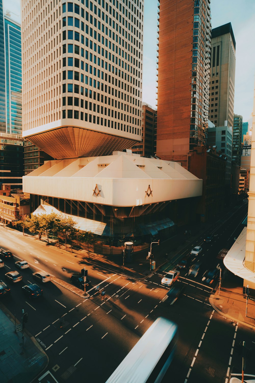 cars on road near building during daytime