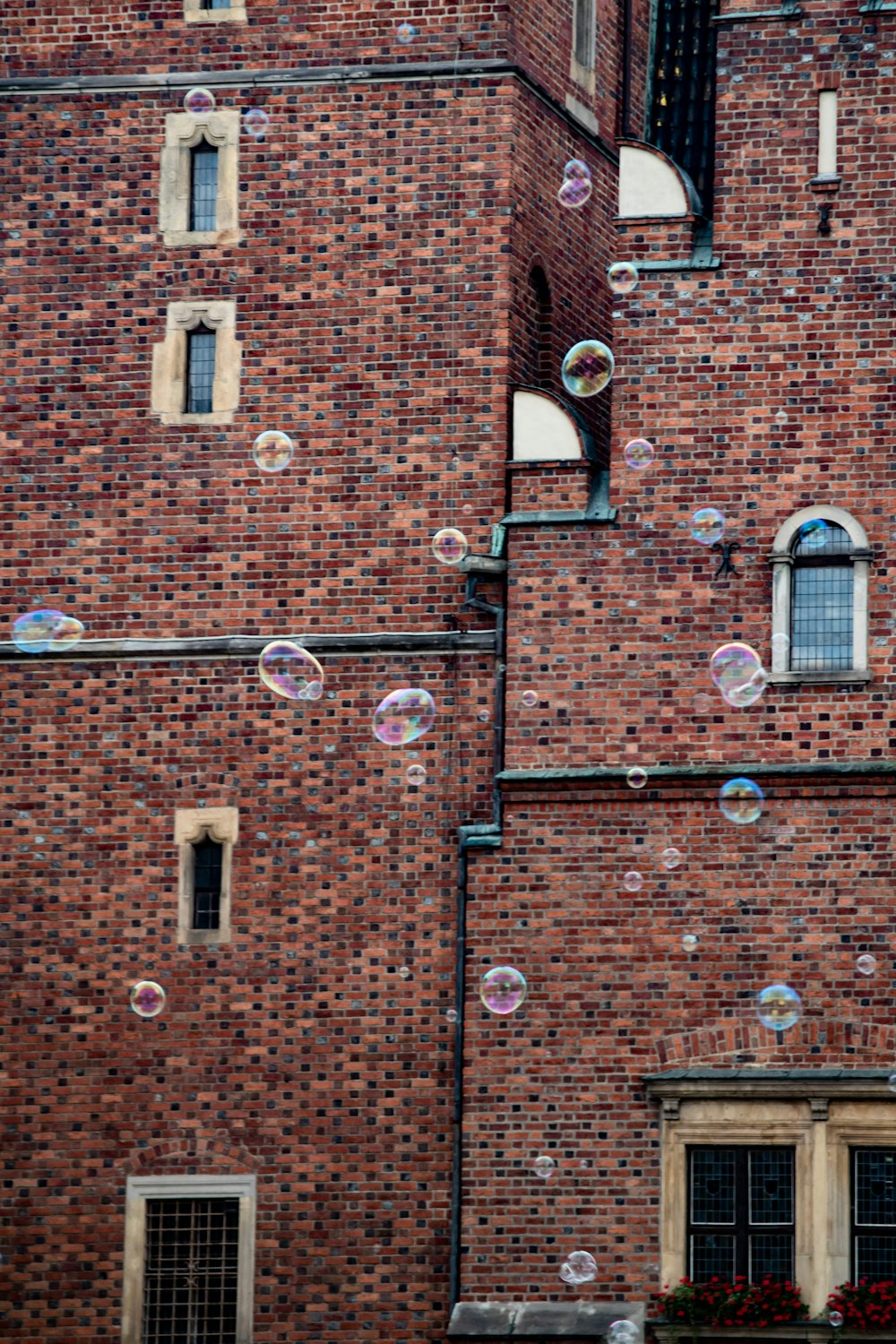 brown brick wall with water droplets
