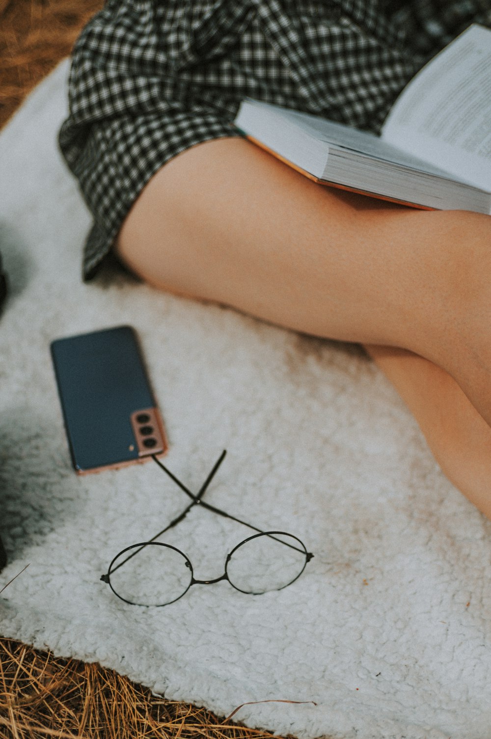 black smartphone on gray carpet