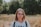 woman in white and black adidas crew neck shirt wearing brown framed eyeglasses