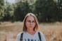 woman in white and black adidas crew neck shirt wearing brown framed eyeglasses