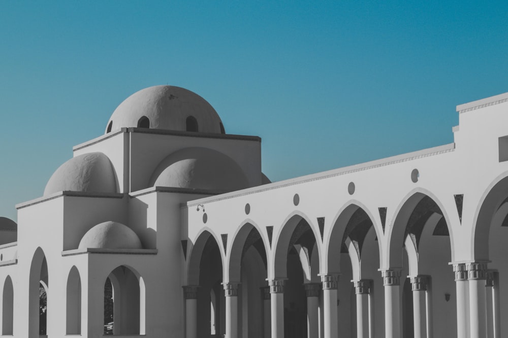 white concrete building under blue sky during daytime