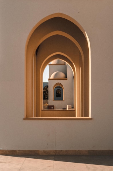 brown wooden framed mirror on white wall