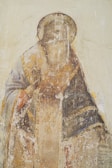 man in brown and black robe painting