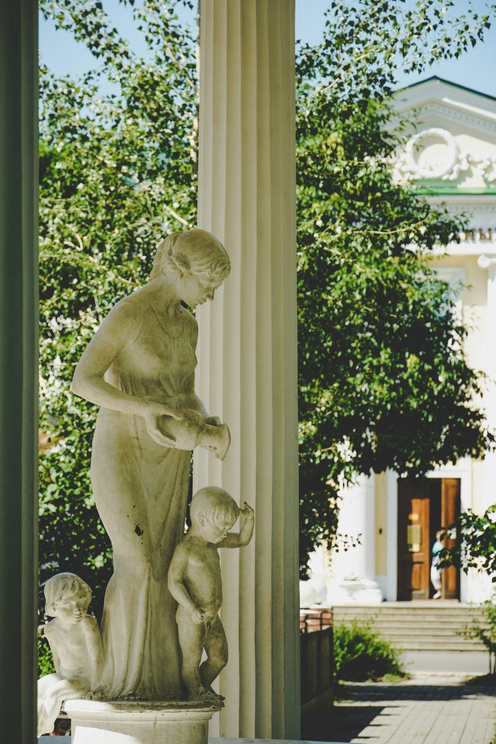 white concrete statue of man