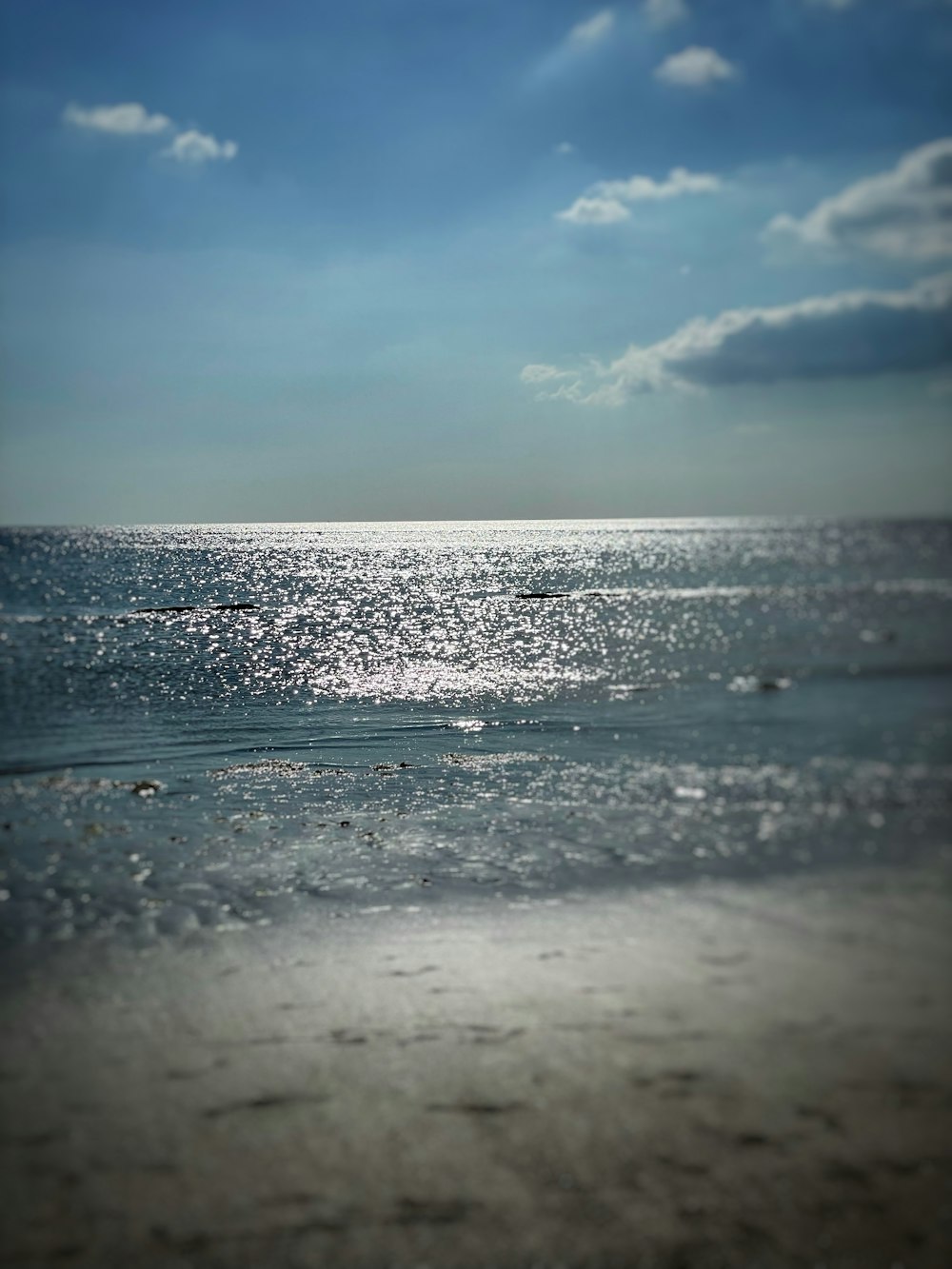 ocean waves under blue sky during daytime