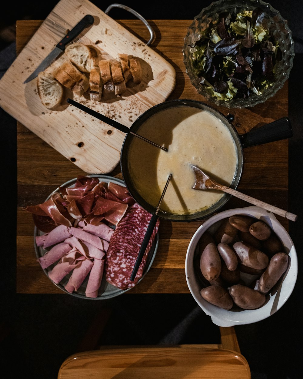 sliced meat on black ceramic bowl