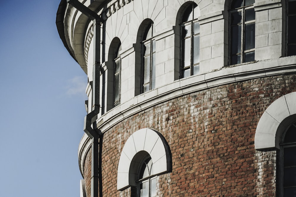 brown brick building under blue sky during daytime